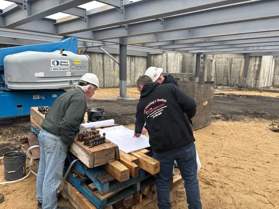 JSP crew reviewing plans on a jobsite